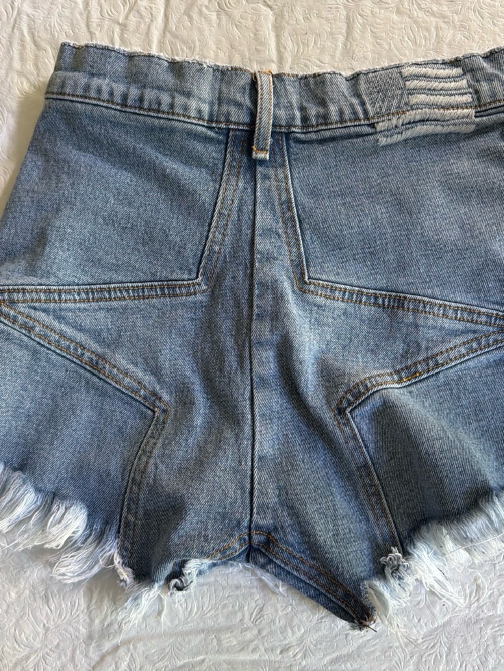 REVICE Distressed High-Waist Denim Shorts in Light Blue